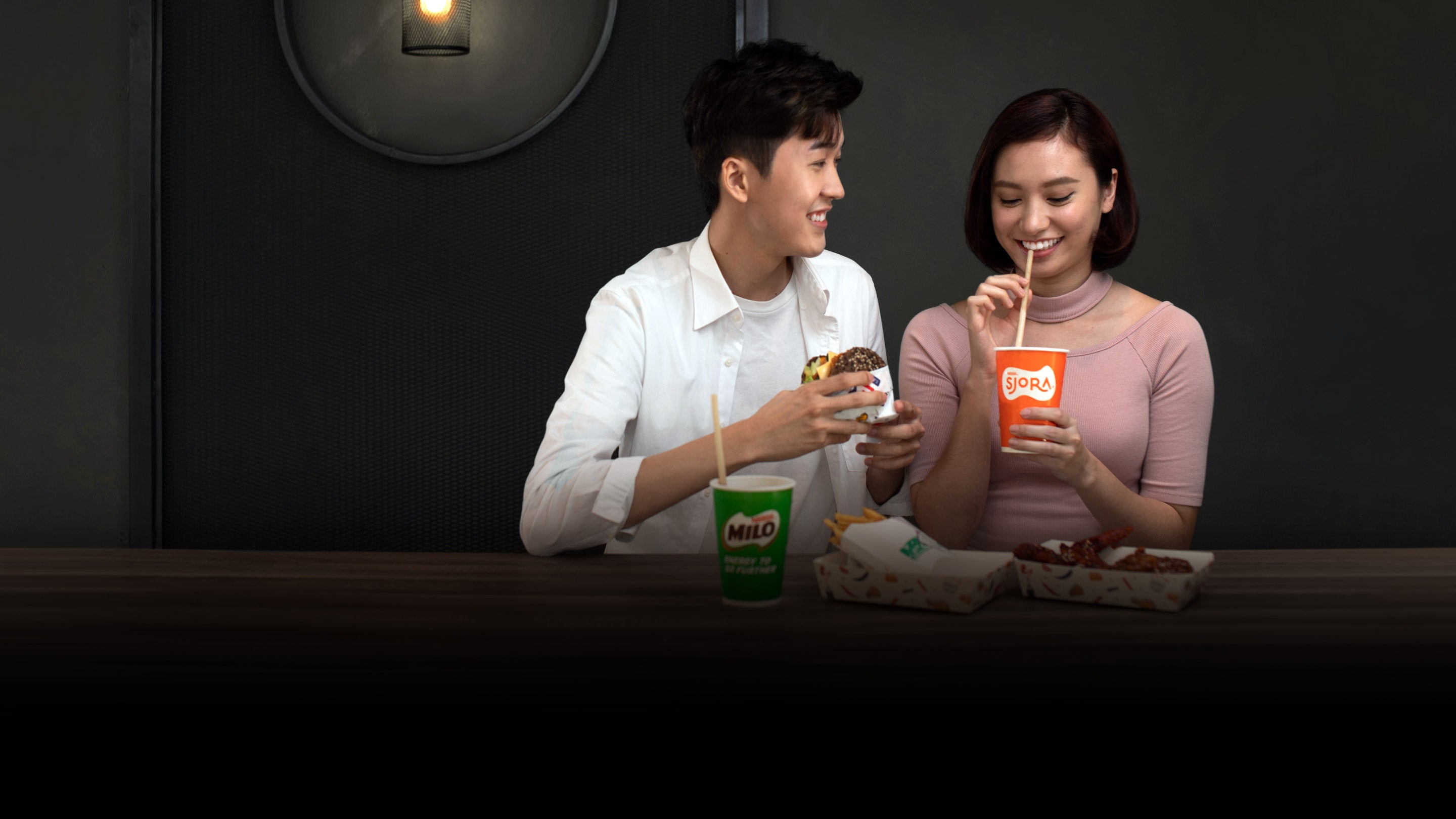 Happy couple drinking Sjora and Milo