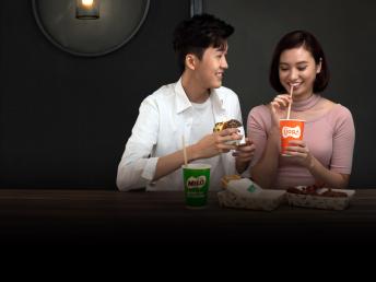 Happy couple drinking Sjora and Milo