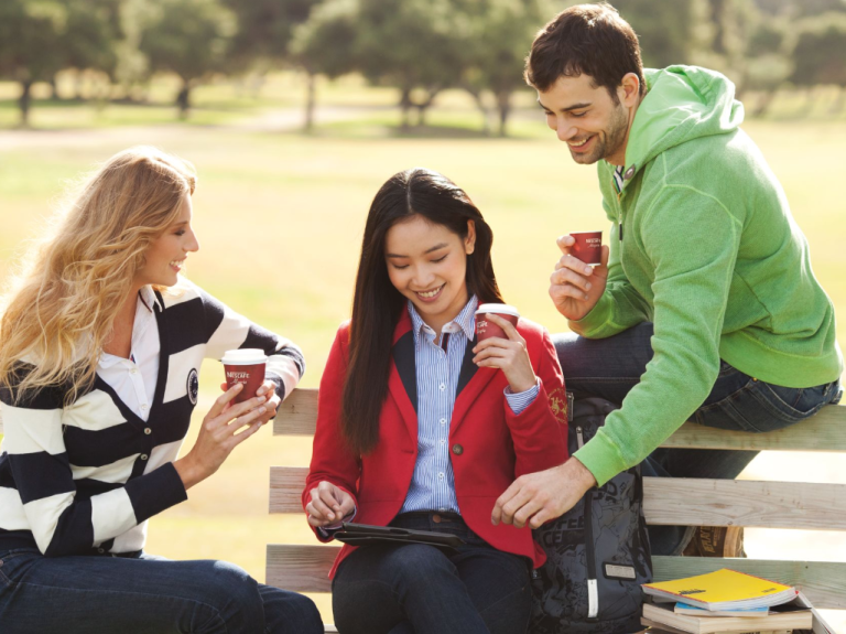 Friends having coffee at park